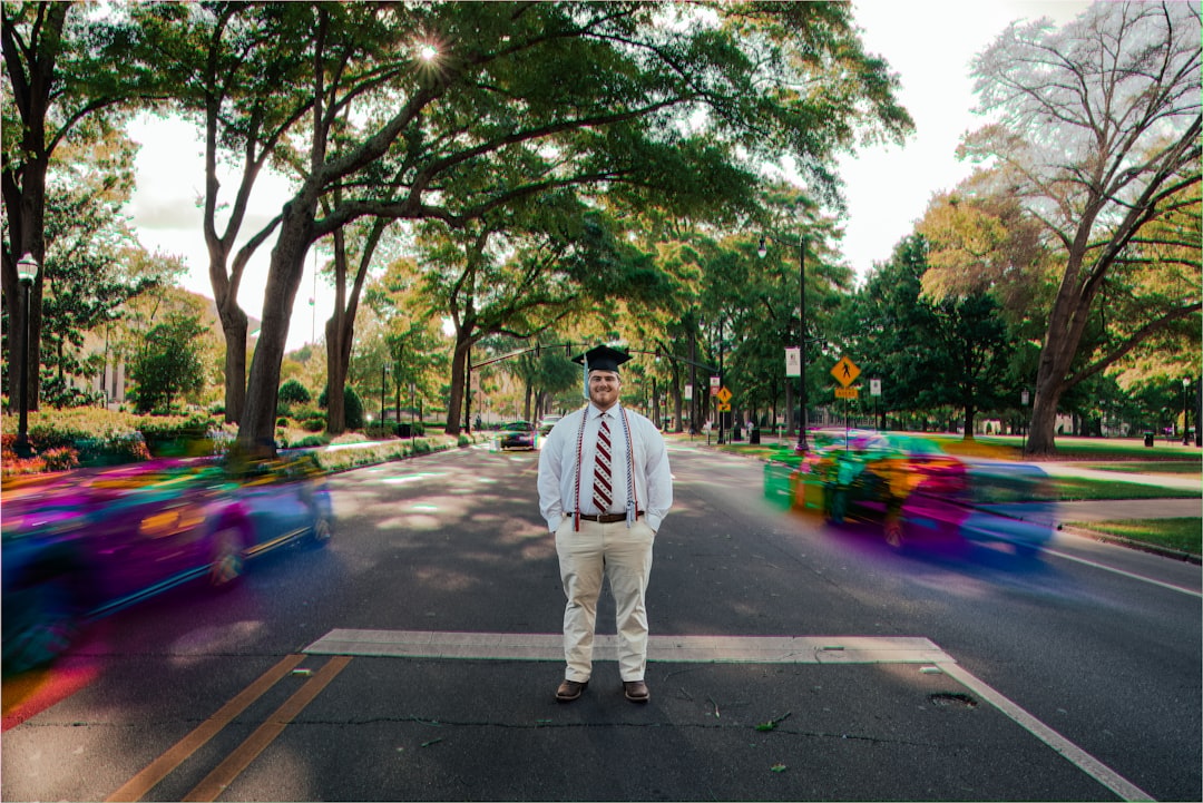 man standing at the center of road