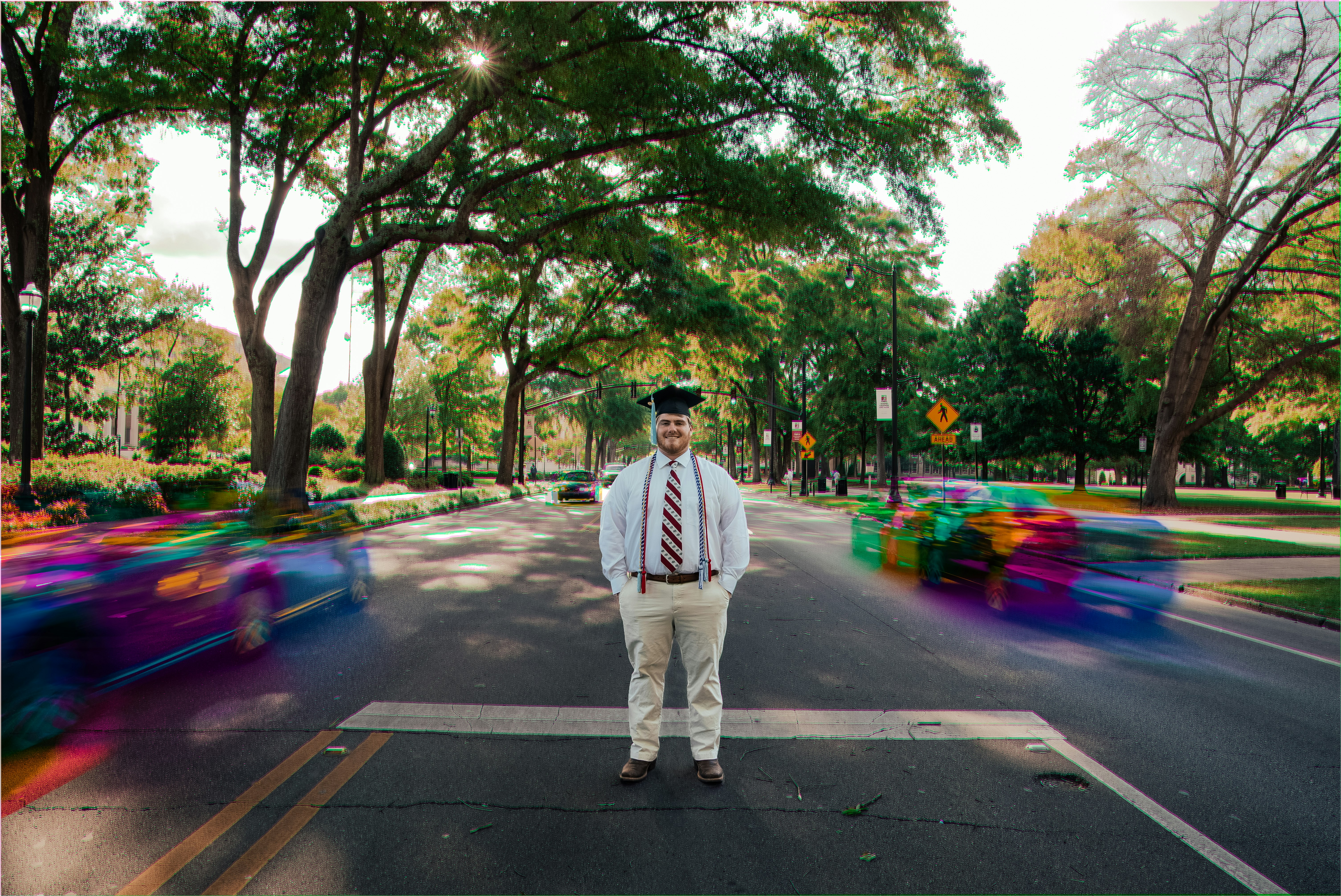 man standing at the center of road