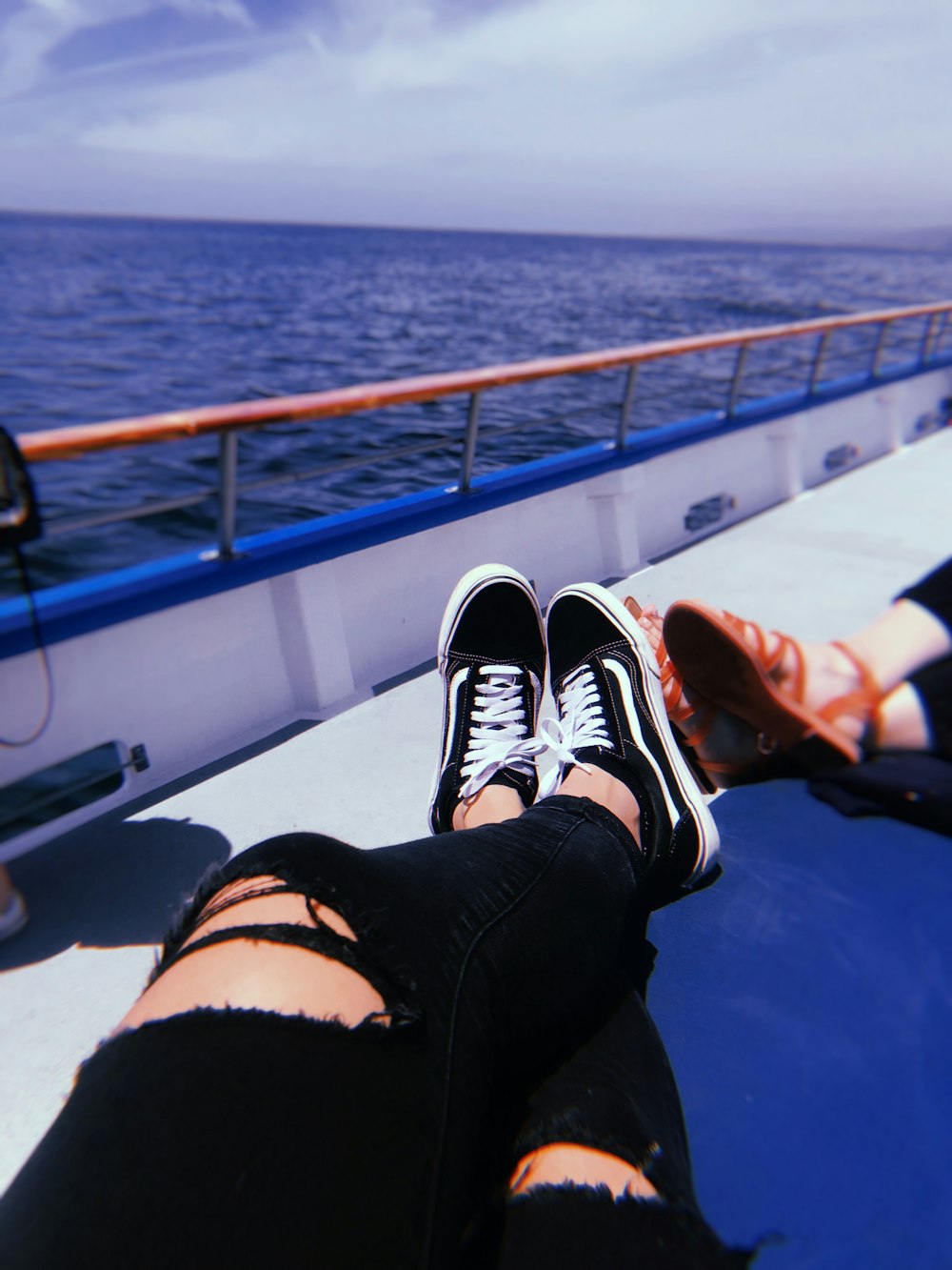 pair of black-and-white Vans Old Skool sneakers