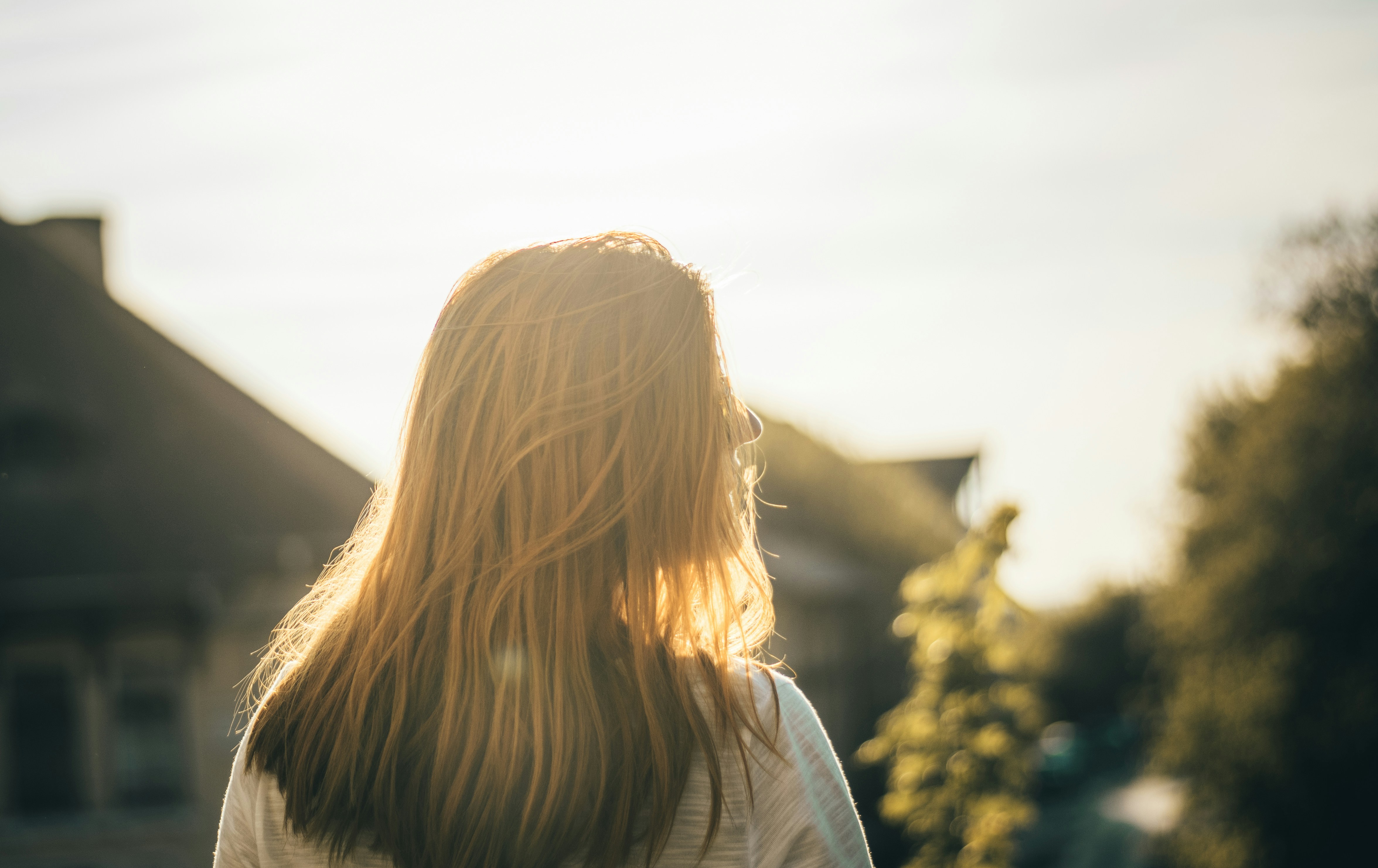 woman in white dress in shallow focus photography