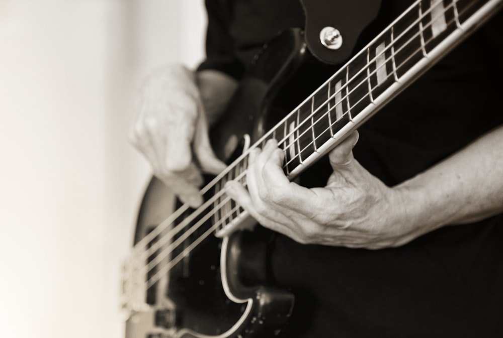 man playing electric guitar