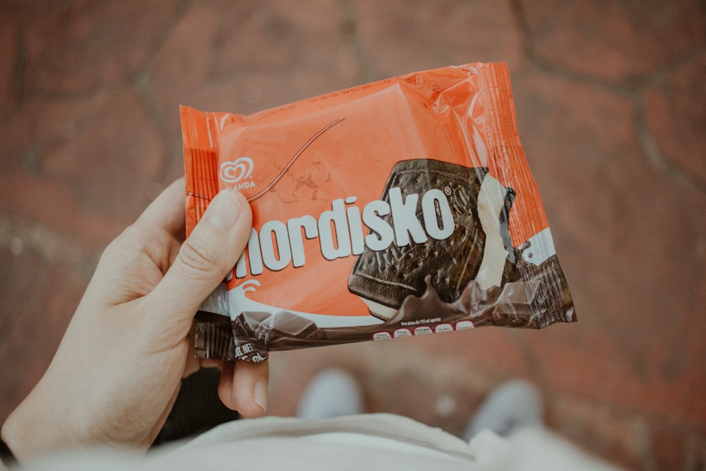 person holding Nordisko biscuit pack