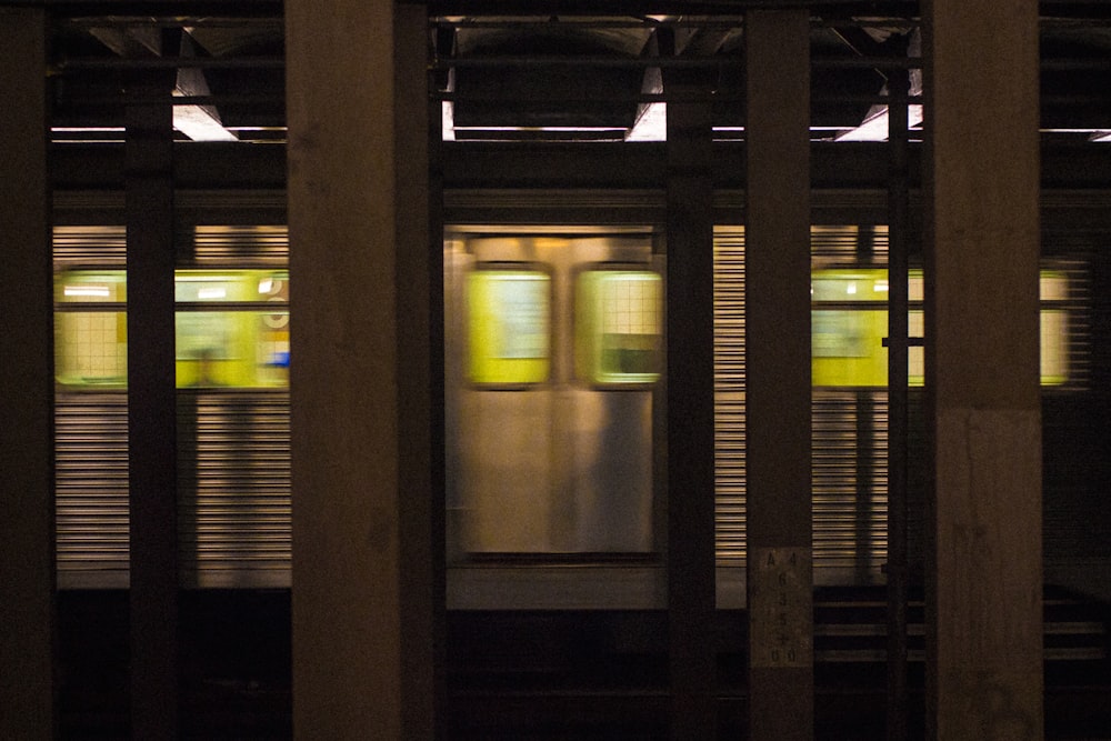 photo of gray train in subway