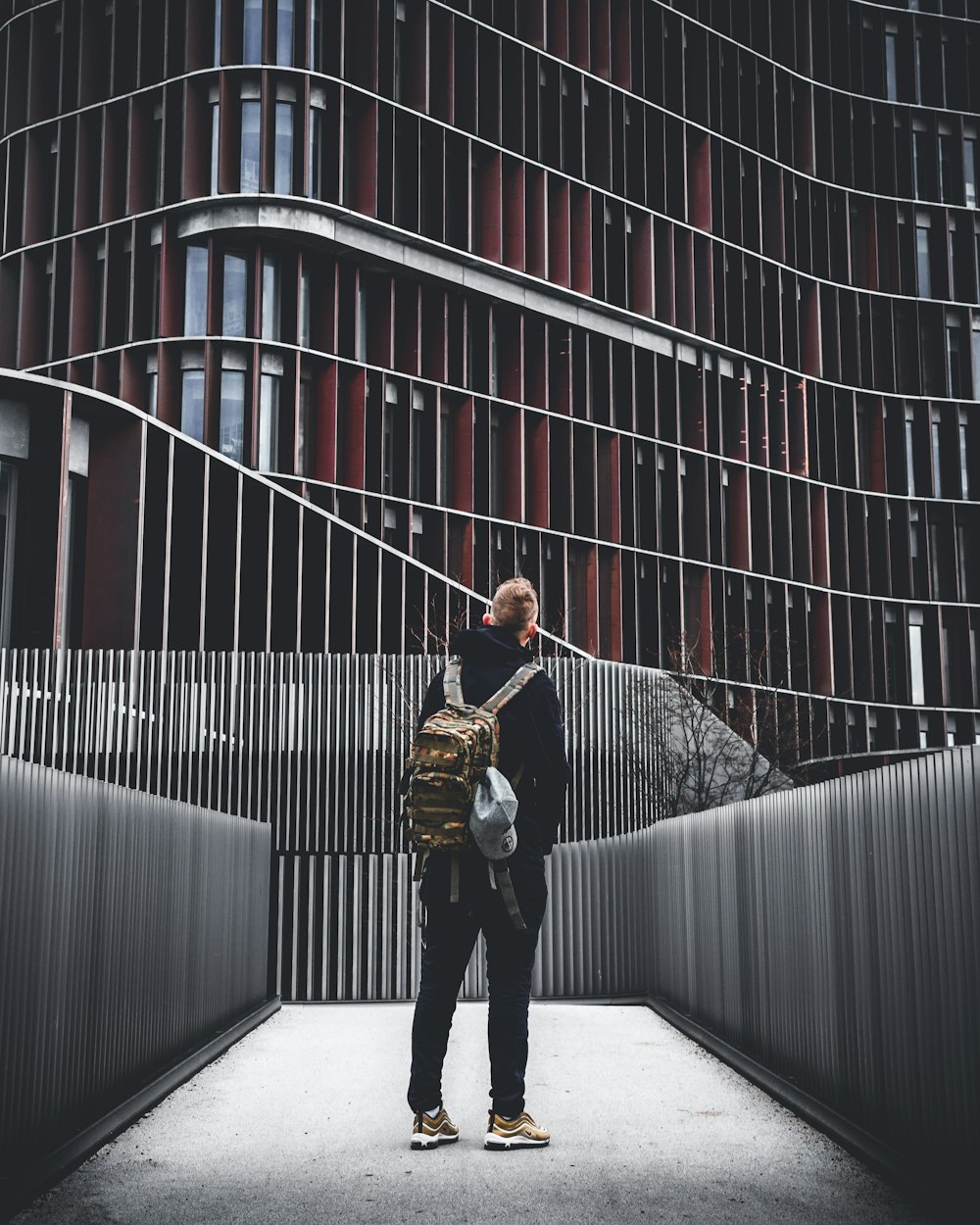 man standing under building