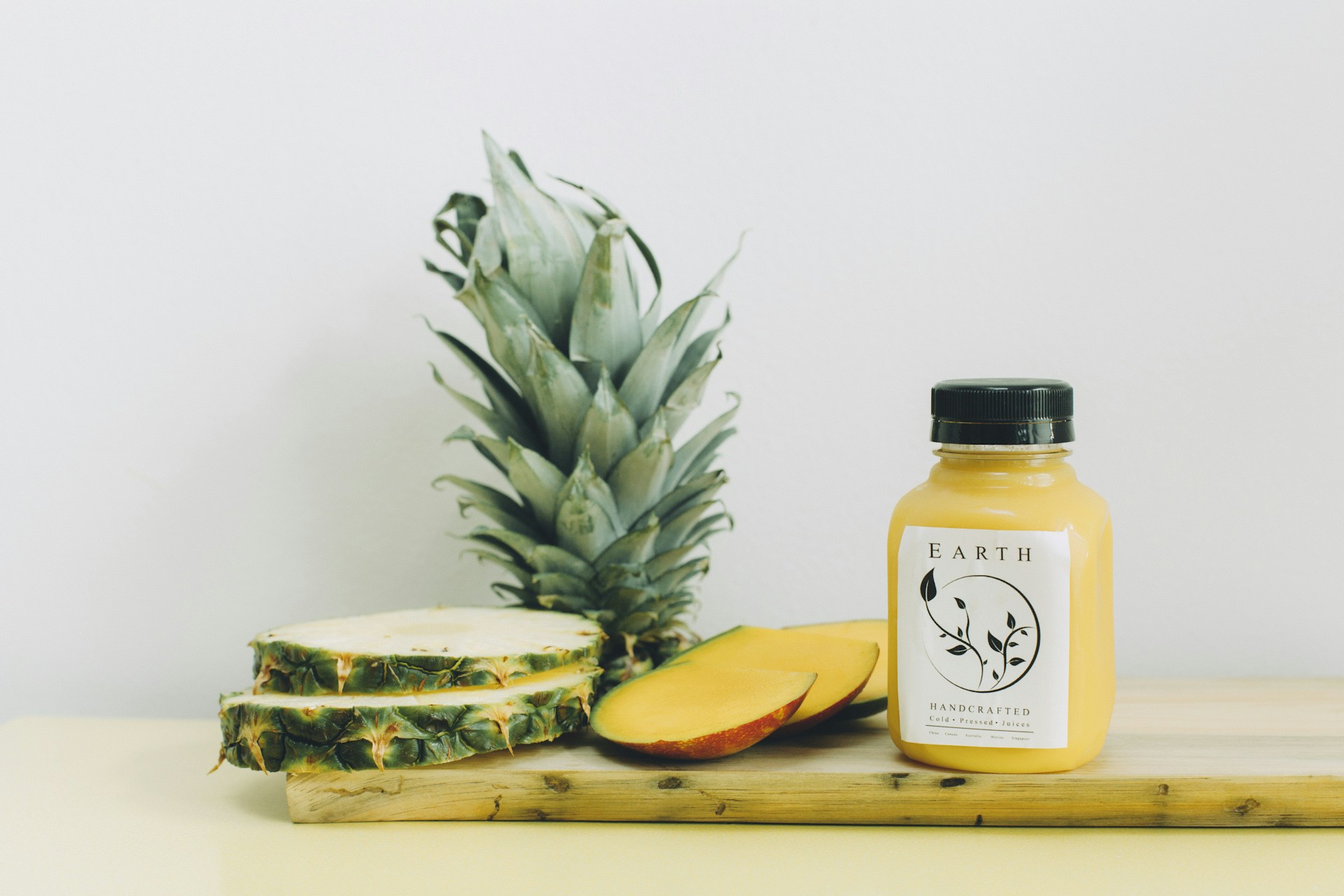 slice pinepple and earth bottle