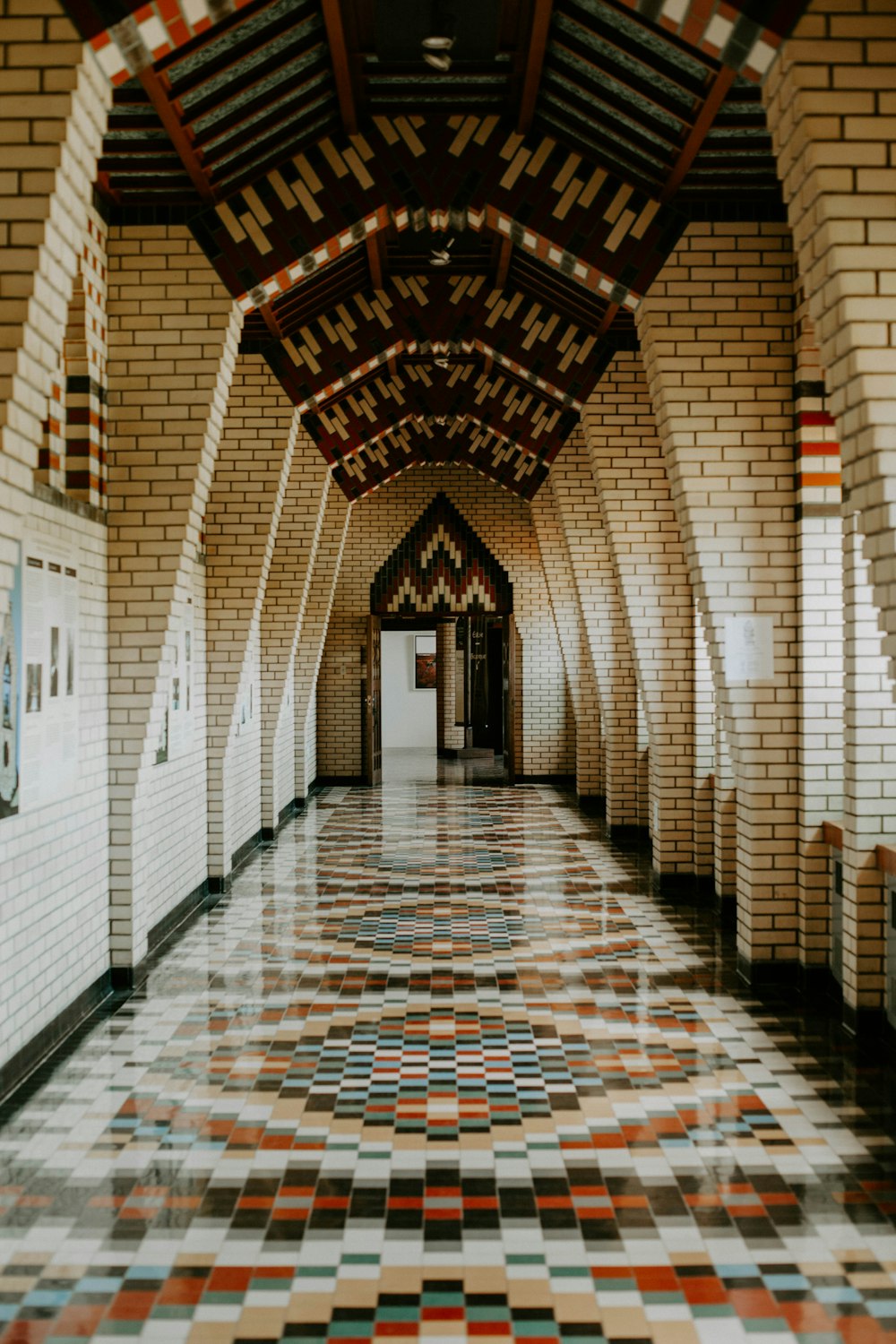 multicolored pathway inside gray concrete building