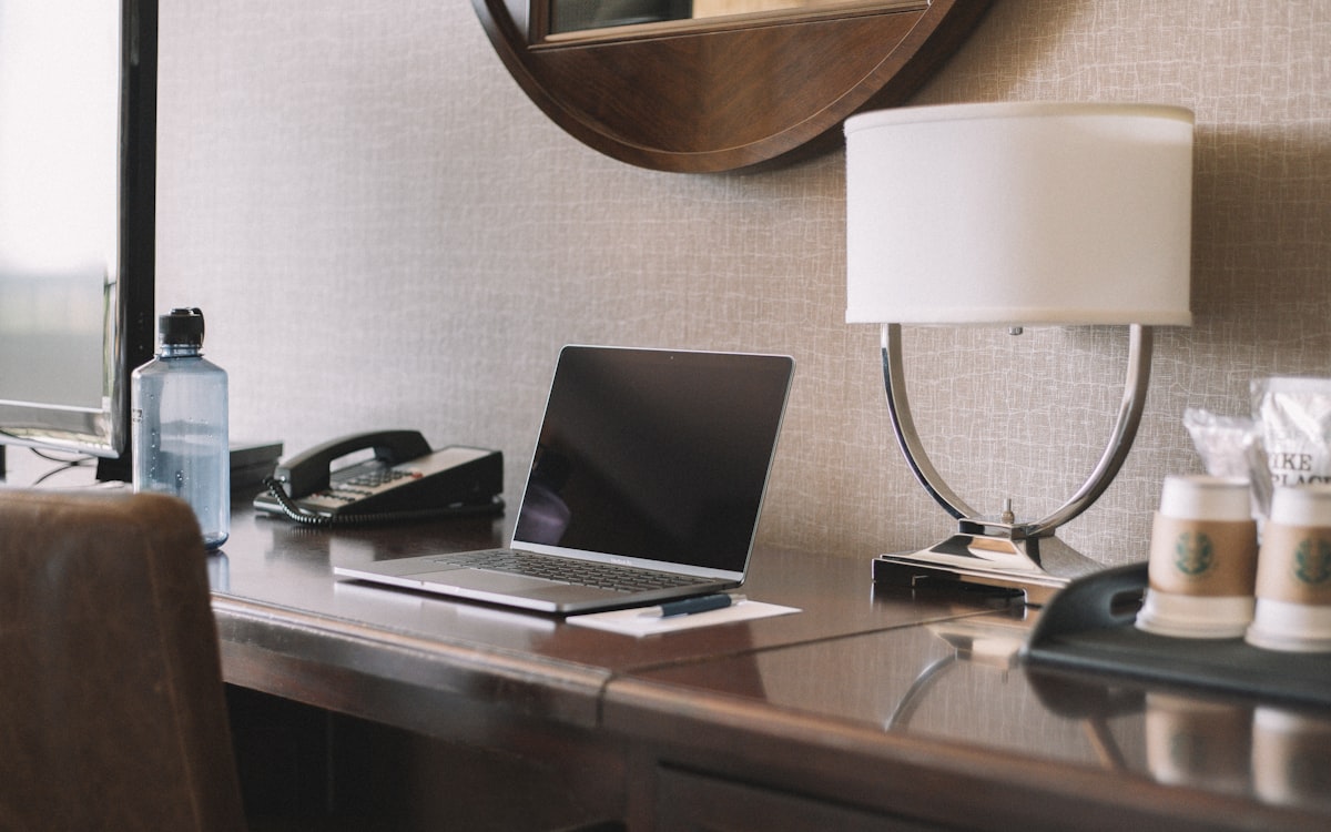 Laptop on desk for rechecking hotel rates after booking