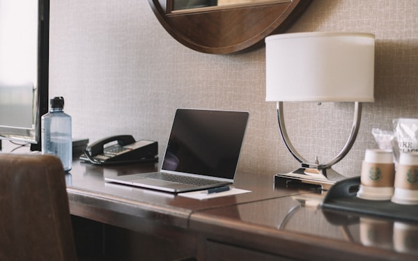 Laptop on desk for rechecking hotel rates after booking