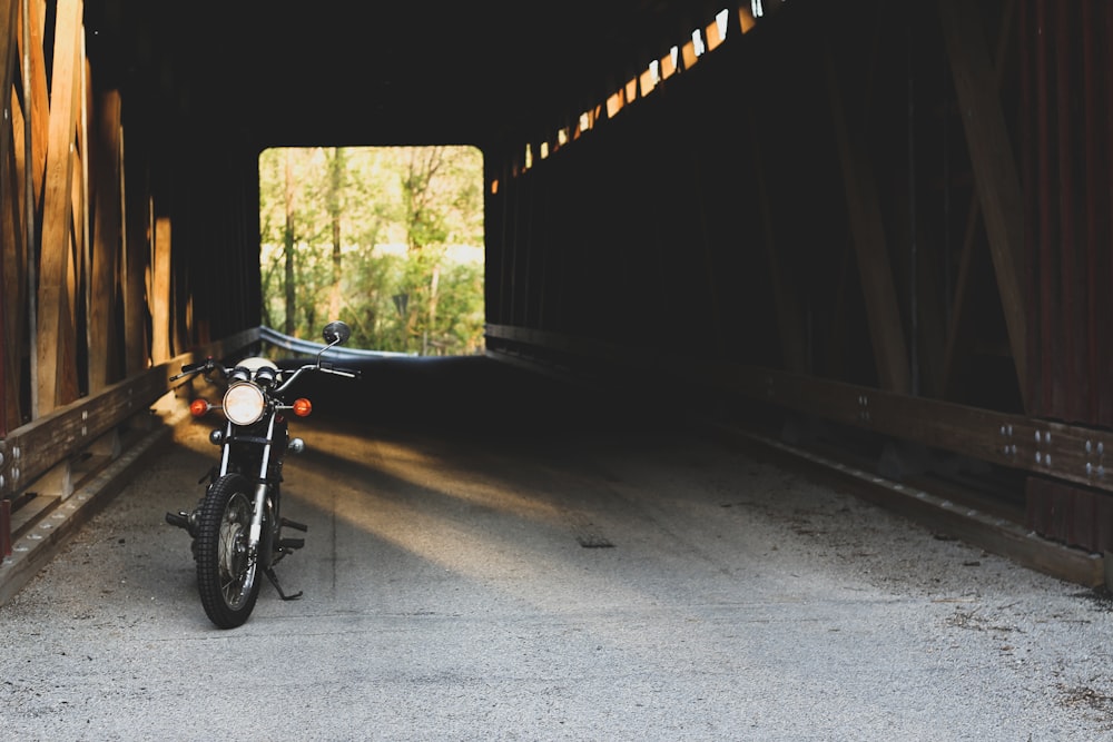 black motorcycle parking inside the tunnel