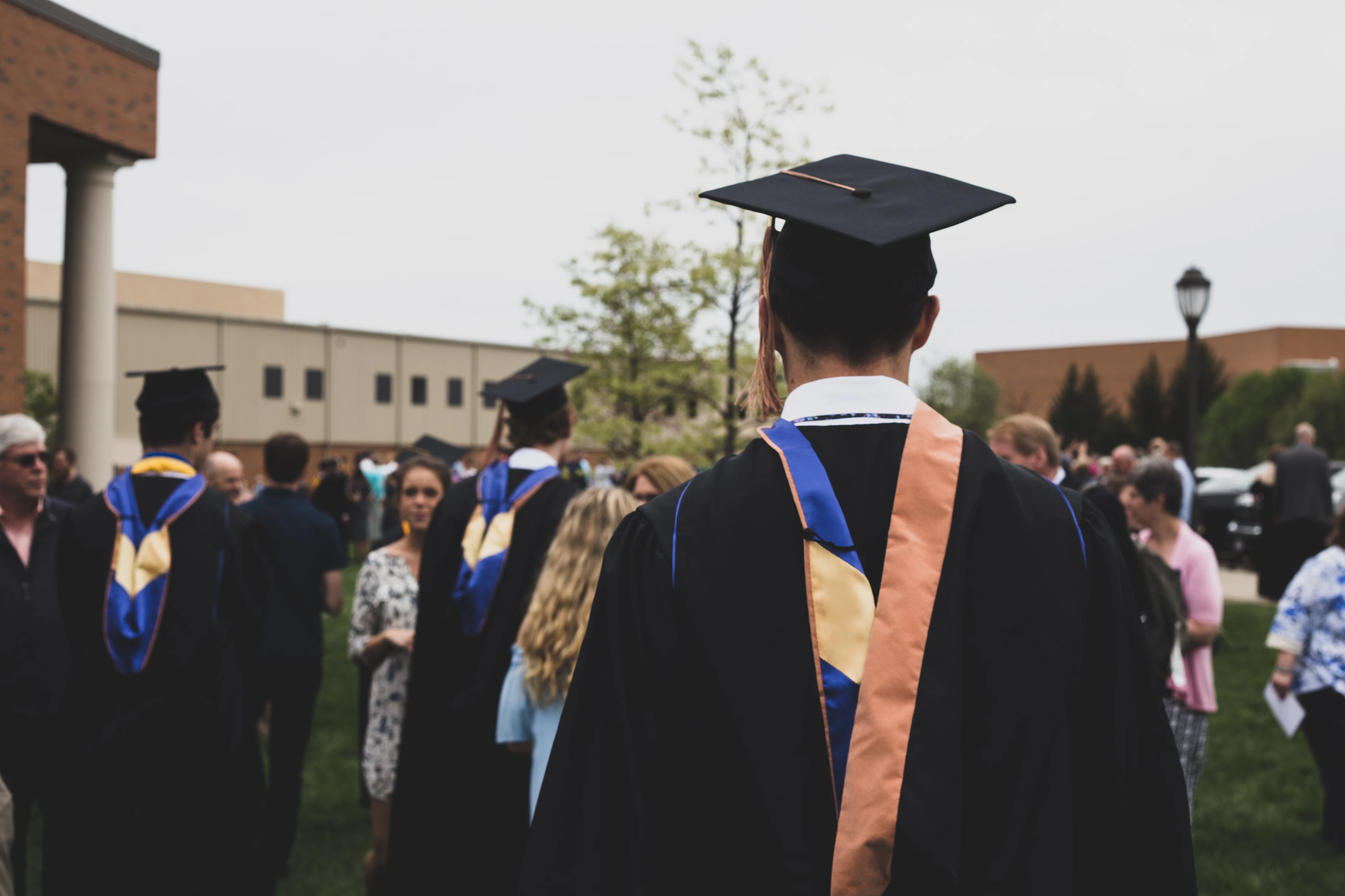Graduating students in caps and gowns at commencement