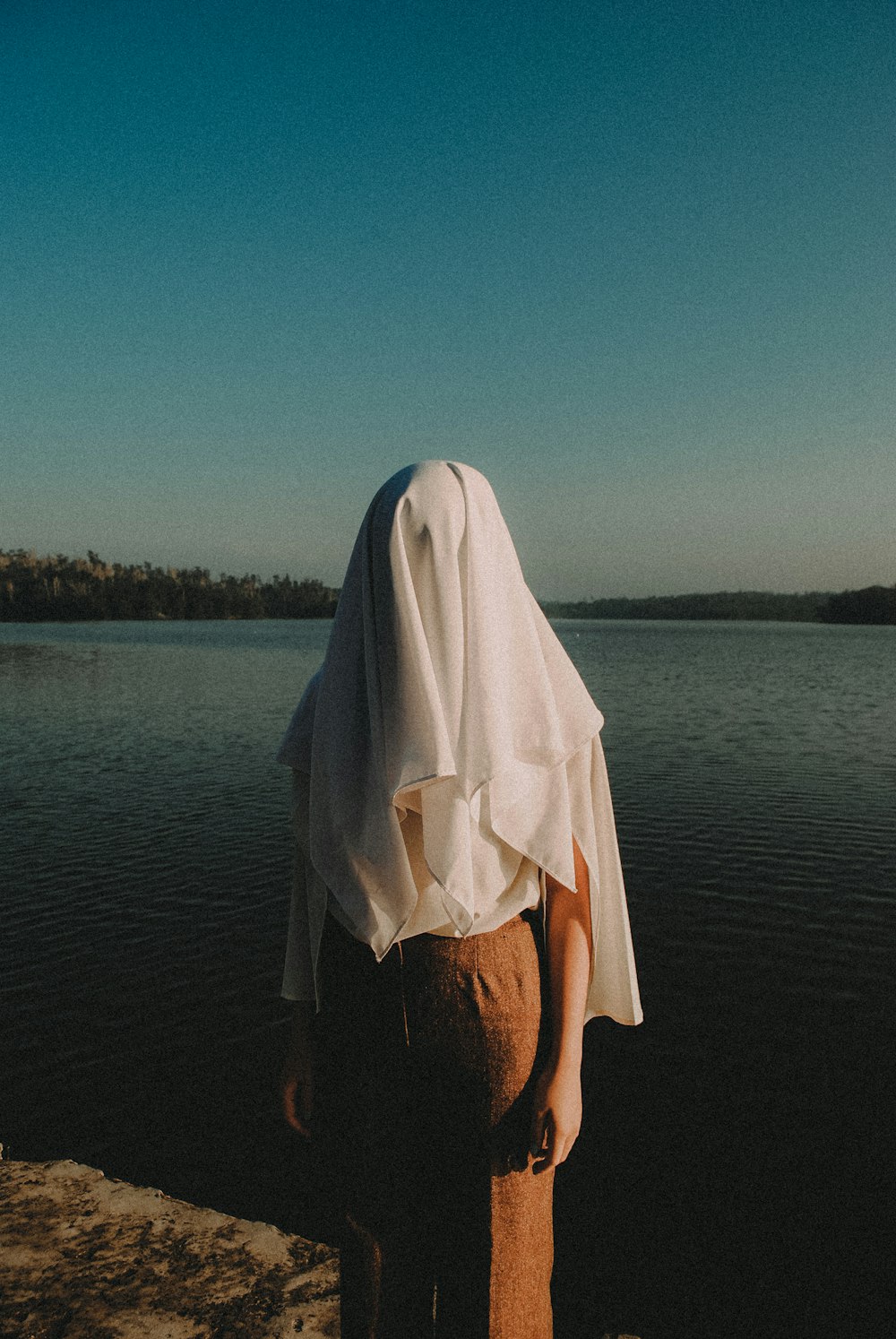 person covered his head with white cloth