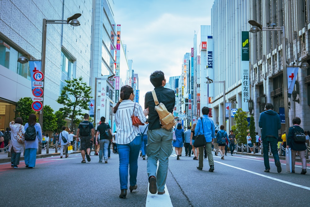 people walking on asphalt road