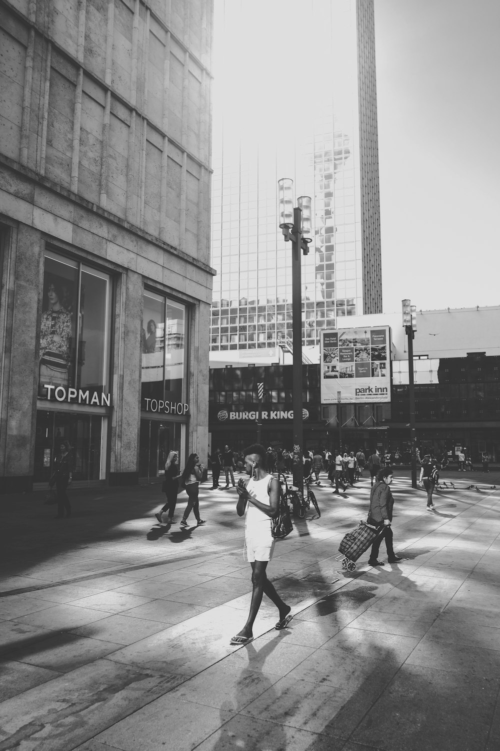 grayscale photo of people walking on the street