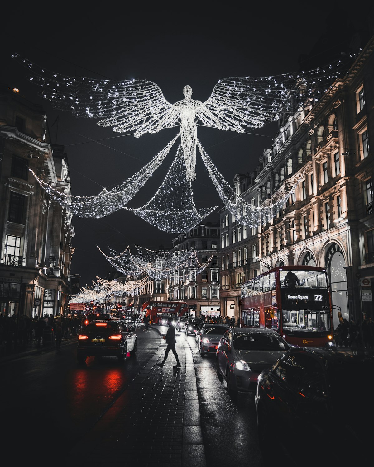 London December — Regent Street illuminated with angel light installations on a winter evening
