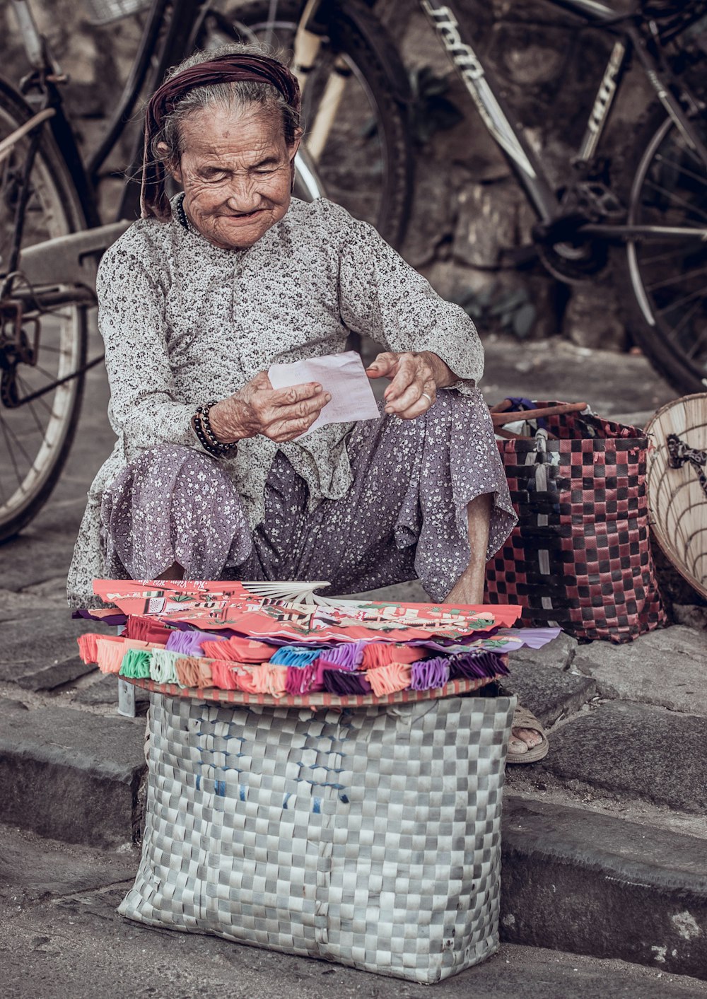 woman sitting near bike