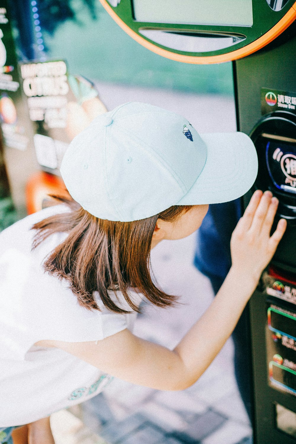 woman touching vending machine