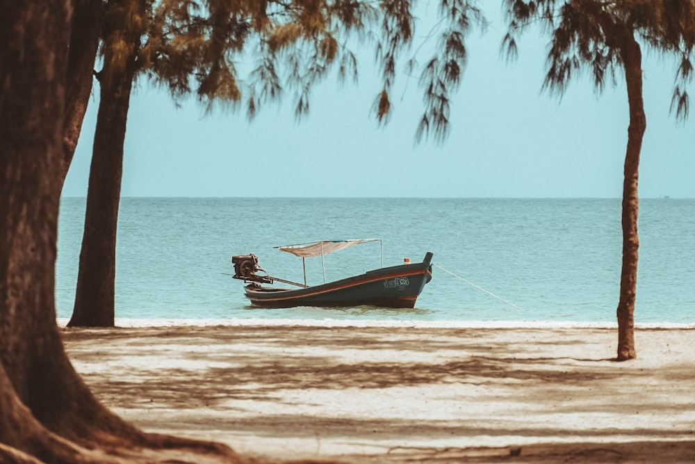 green power boat on sea