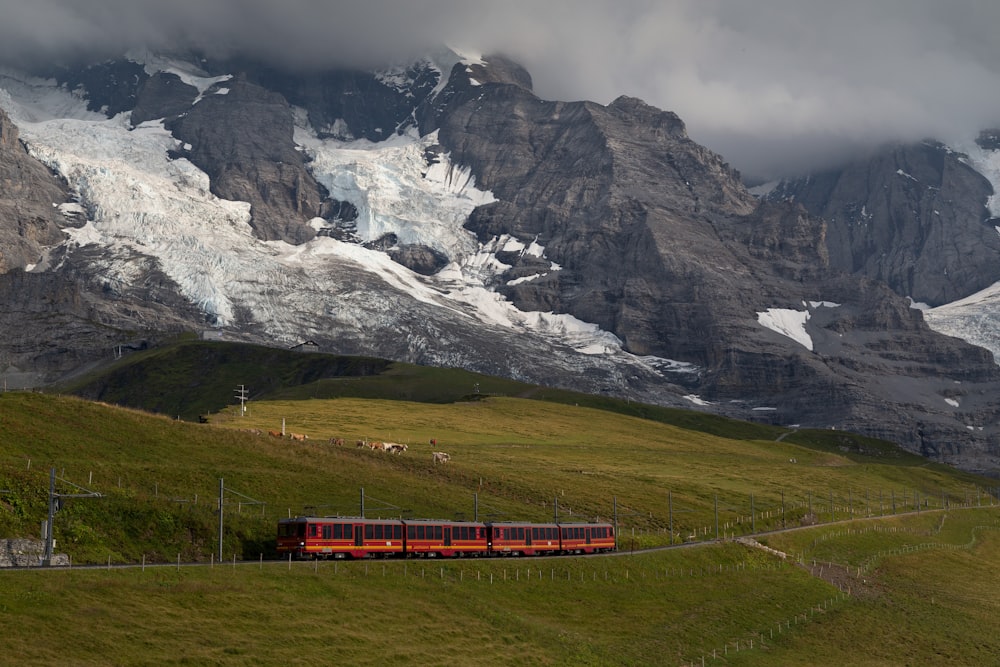 red train near mountain