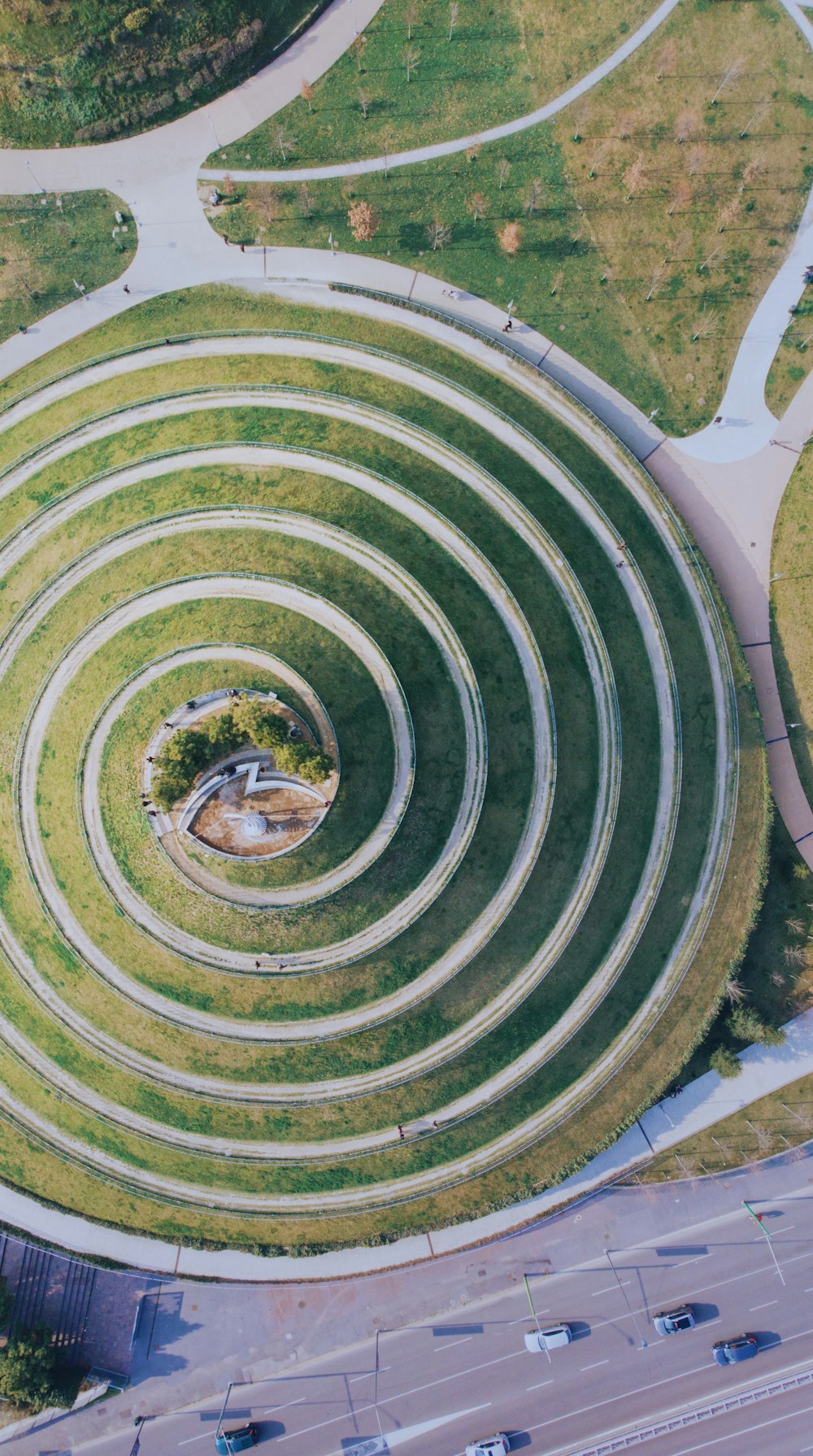 drone shot of road and grass field