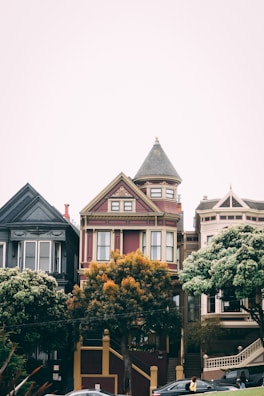 Portrait of Buxton-Hollis founding families in front of their homes.