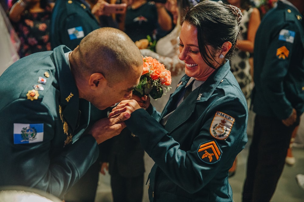 man giving flower bouquet to a woman