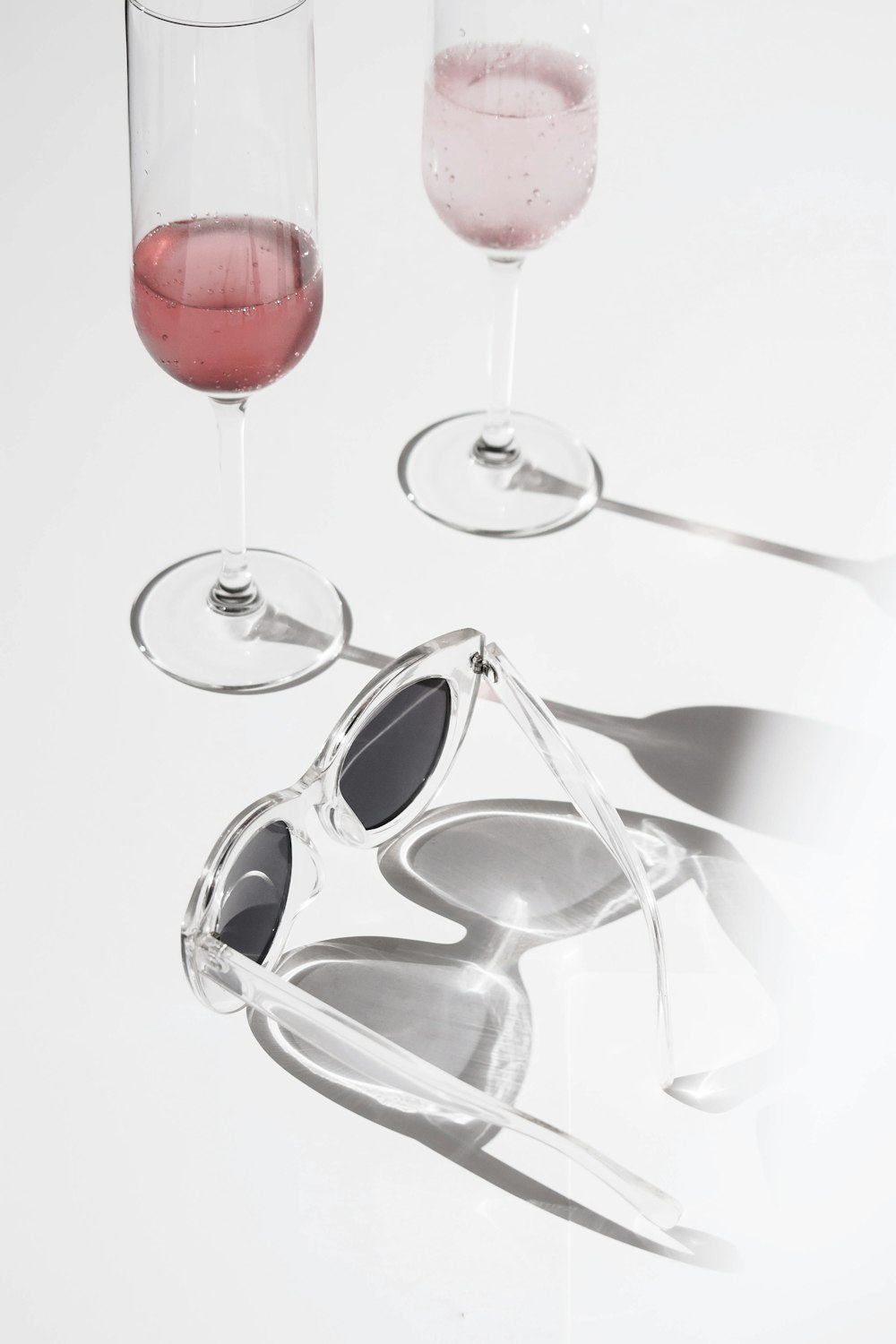 two clear footed drinking glasses photo