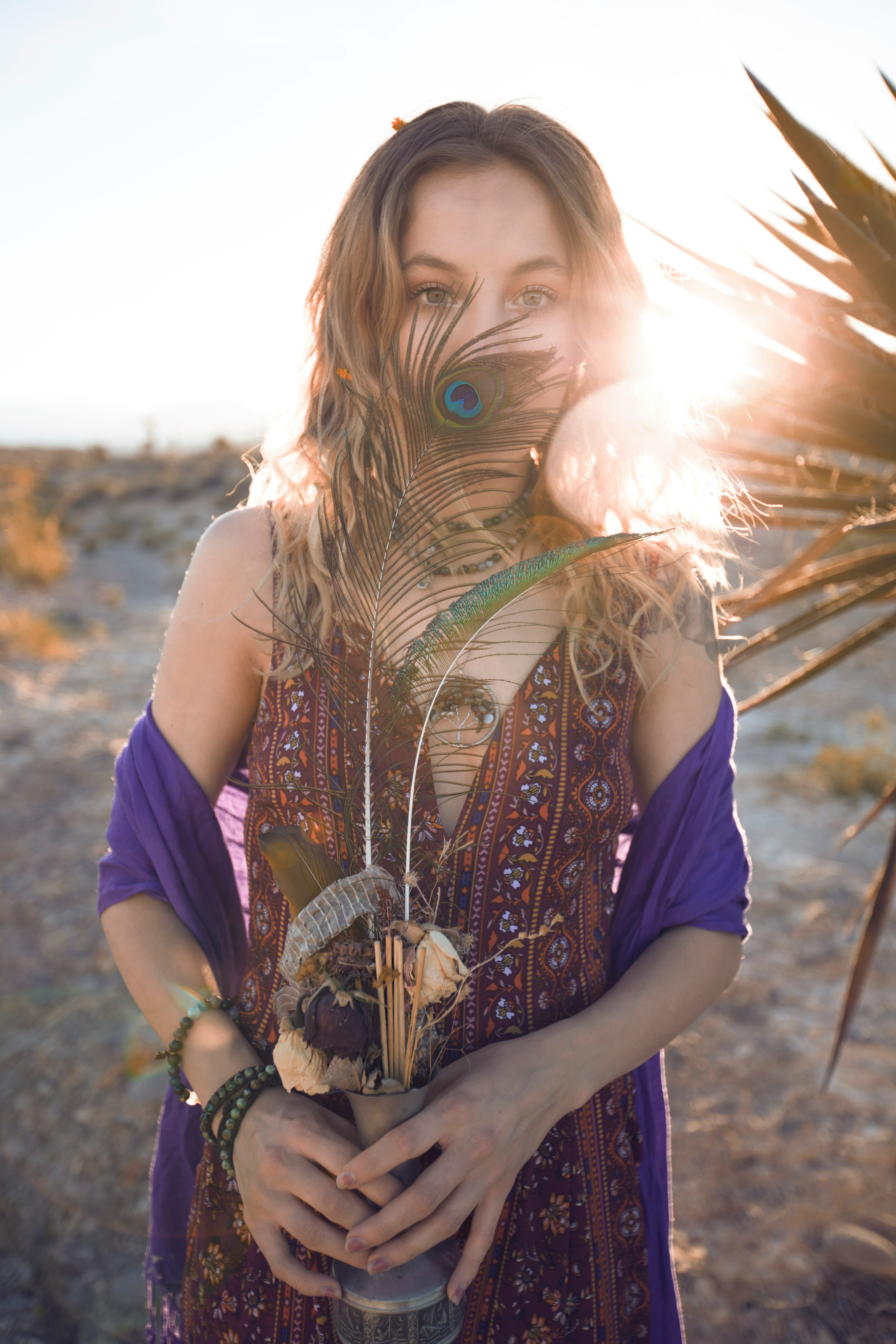 person holding flower vase