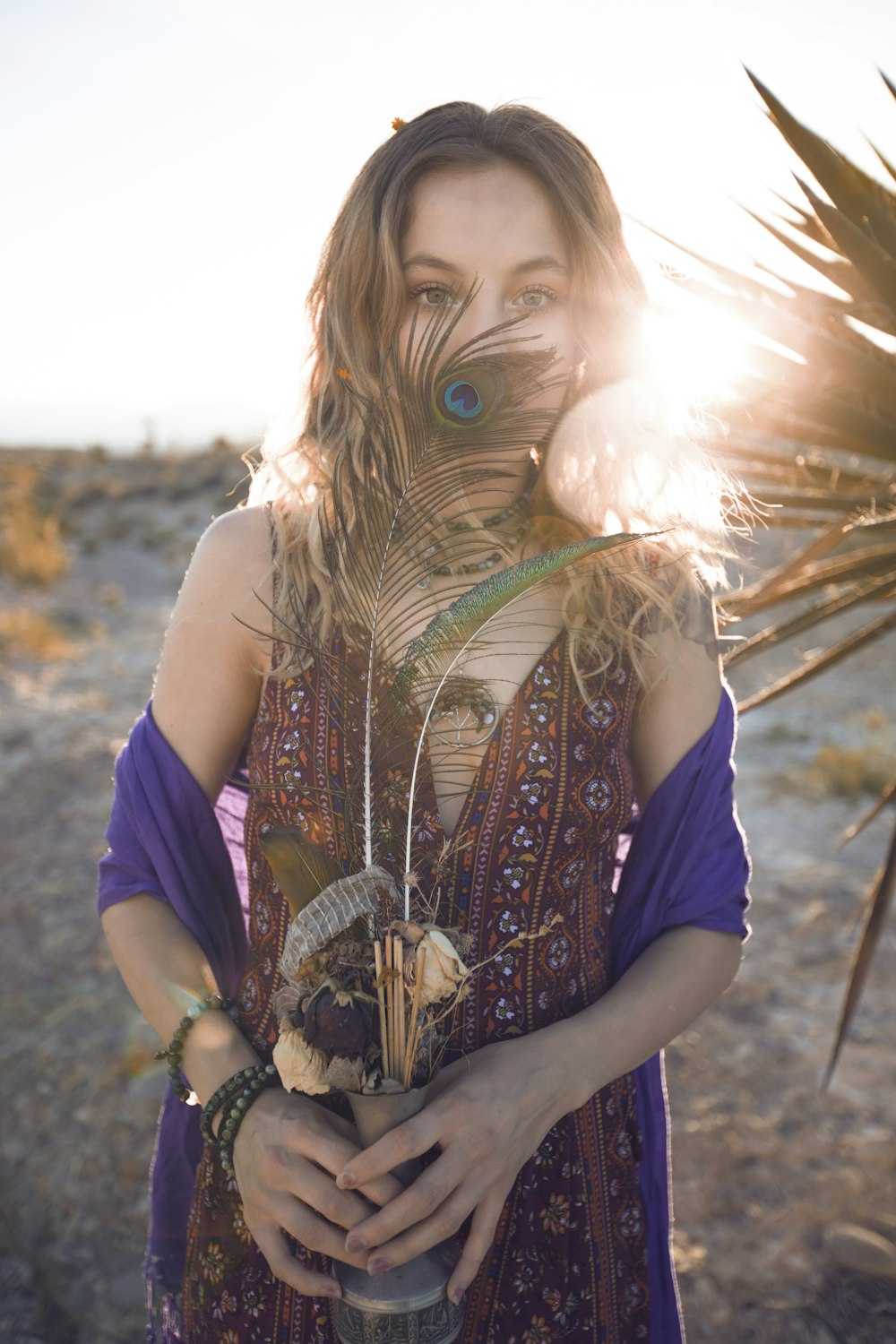 person holding flower vase