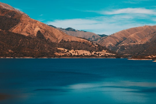 body of water surrounded by brown mountains in San Juan de la Maguana Dominican Republic