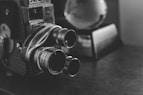 photo of 3-lens camera on table surface