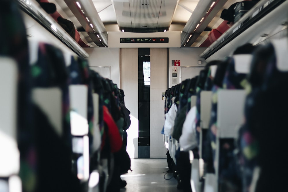 photography of people sitting in vehicle