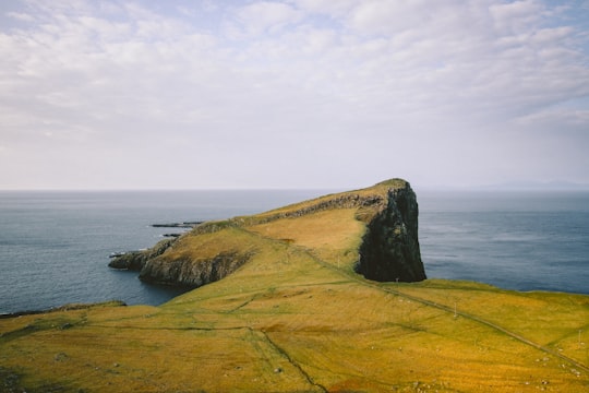 cliff near body of water in Scotland United Kingdom