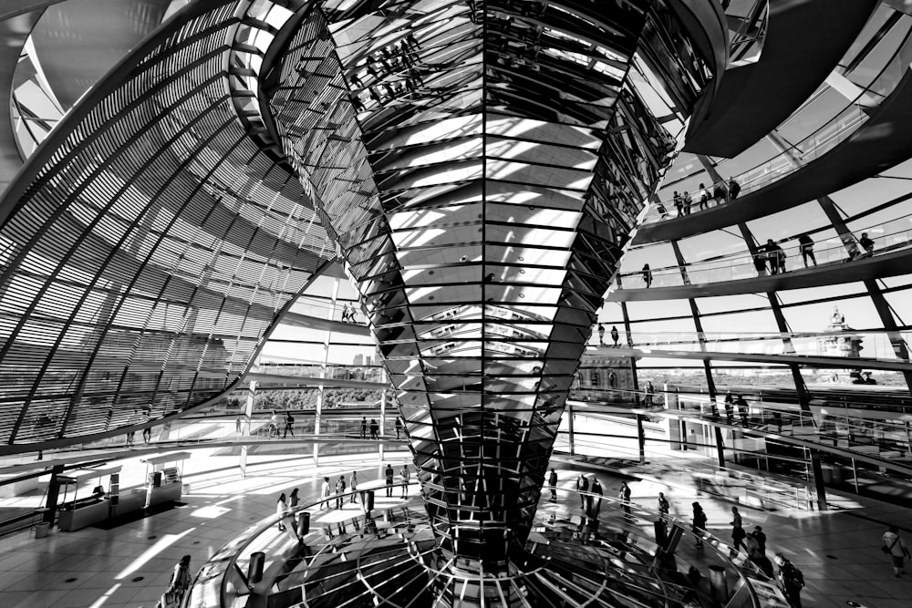 grayscale photography of people inside building