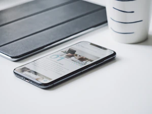 black smartphone beside black smart case