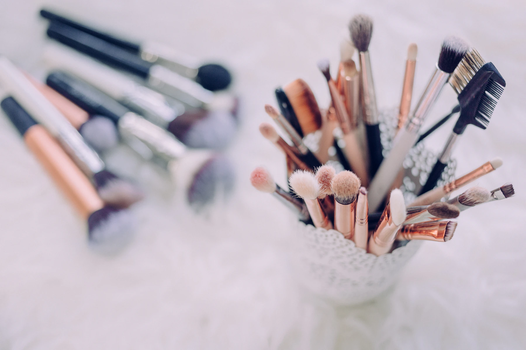 Professional makeup brushes displayed in a clean beauty workspace for care and organization