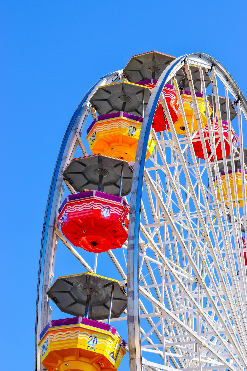 photo of a Ferris wheel under blue skies