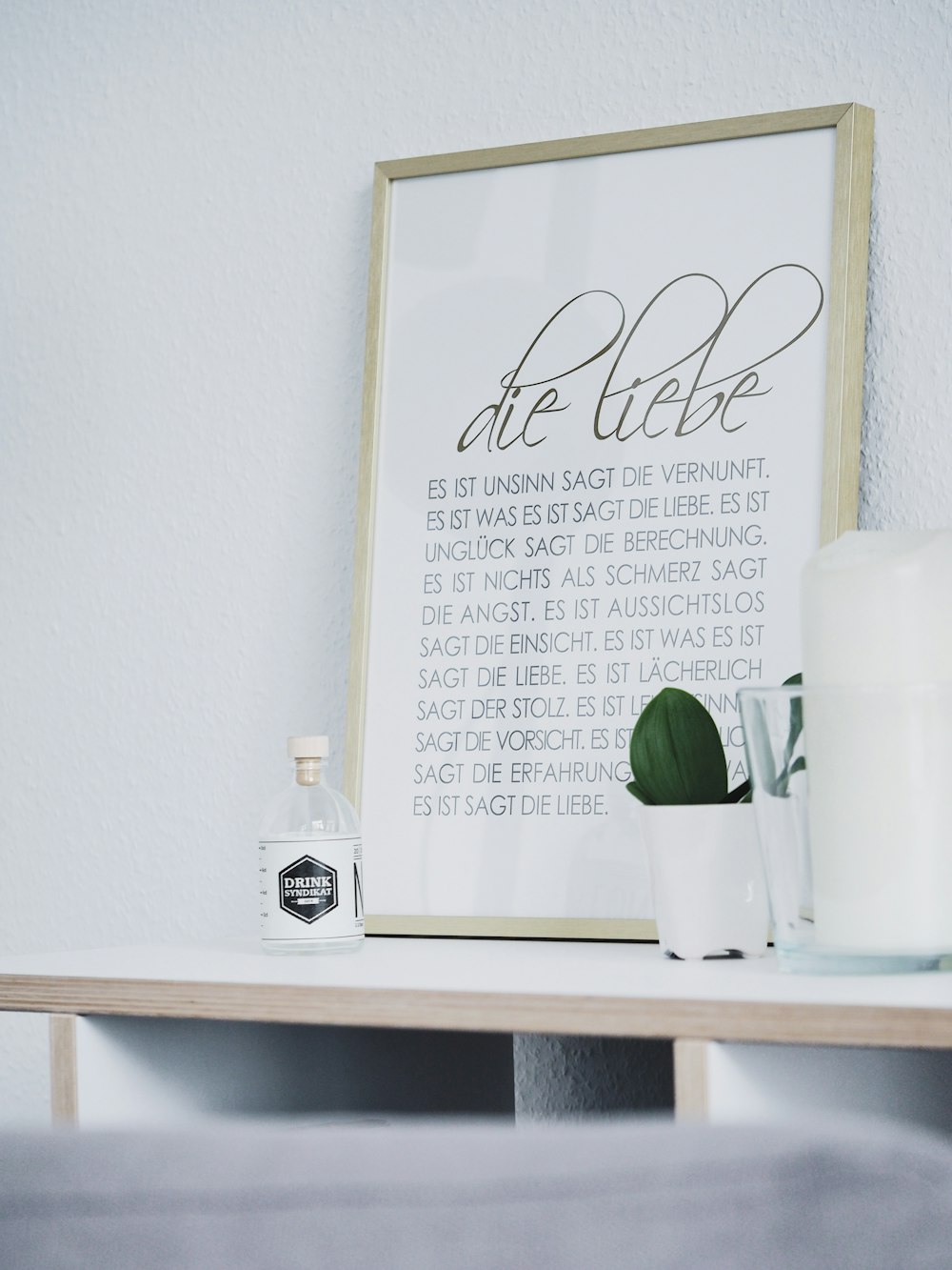 rectangular brown framed photo frame on white desk