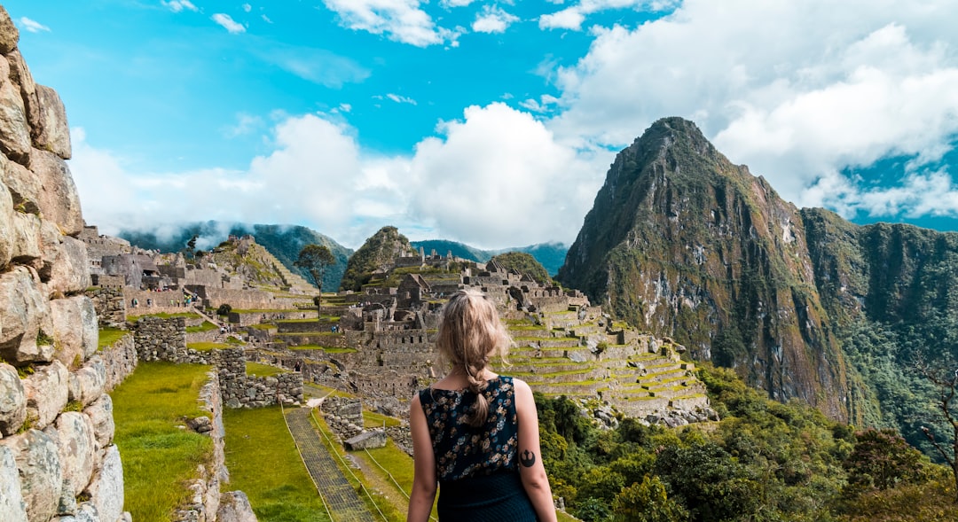 woman facing Machu Picchu