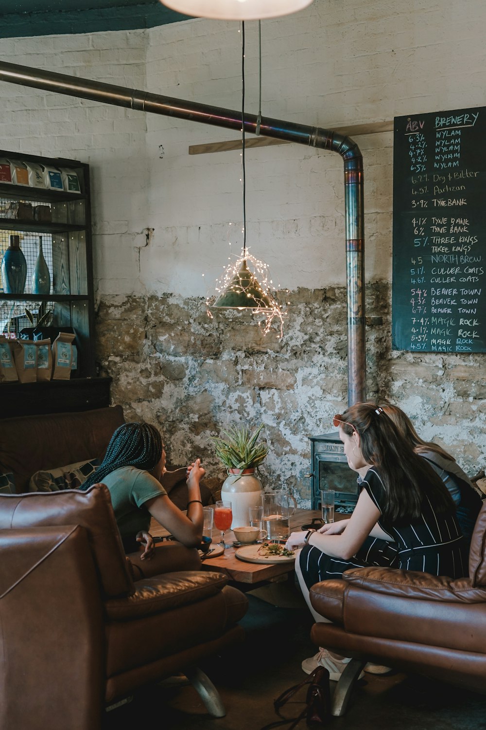 person sitting on chair in front of table