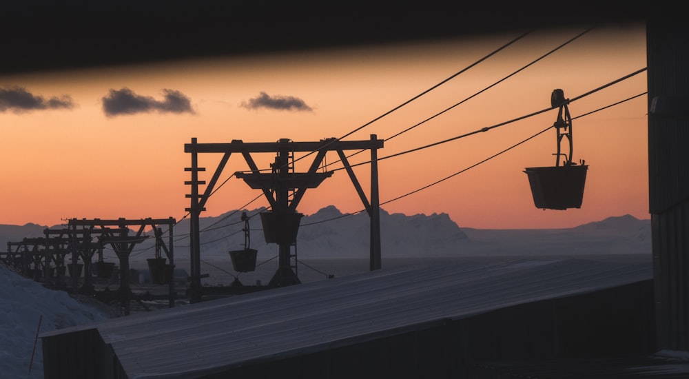 silhouette of cable car during sunset