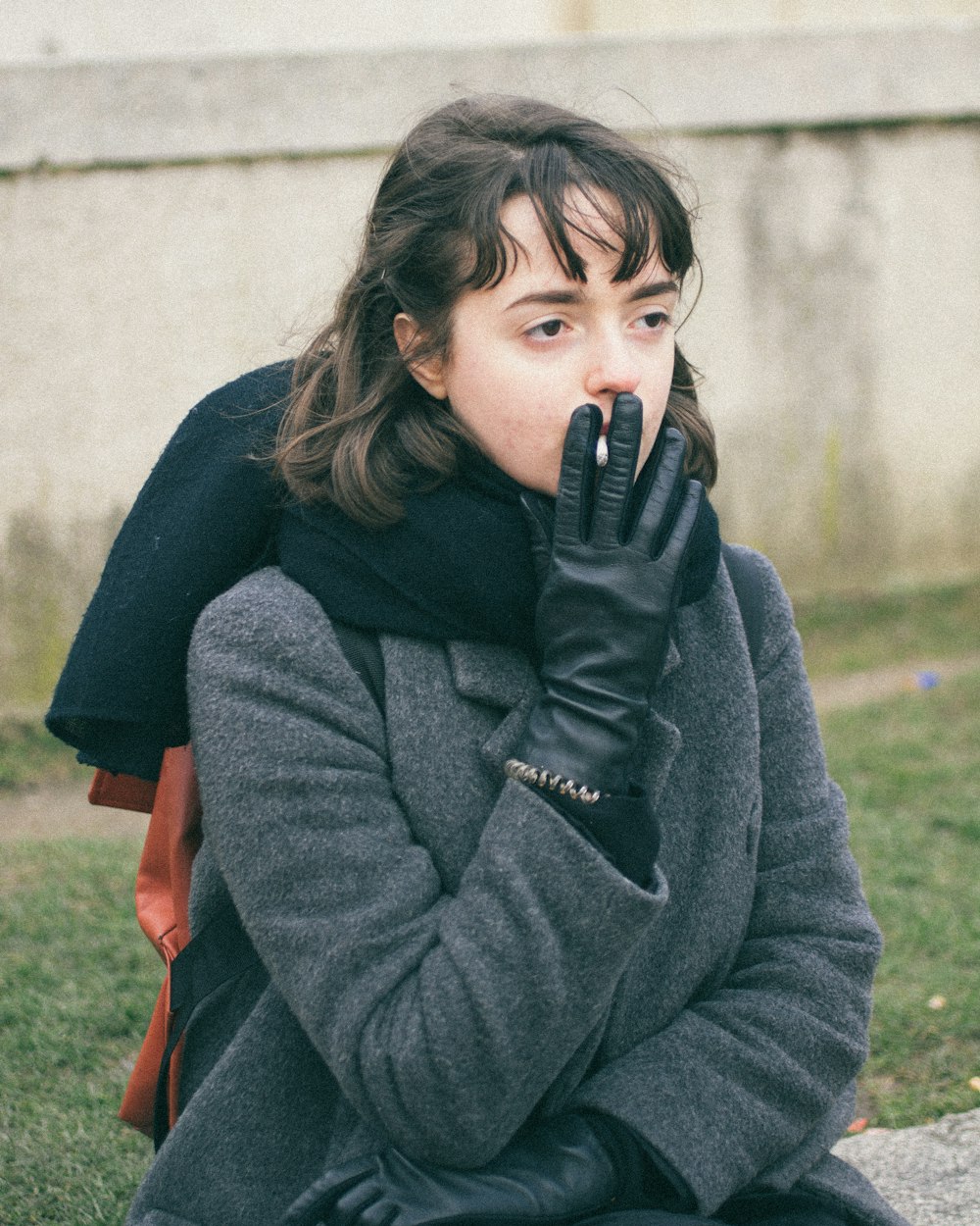 woman smoking cigarette outdoors