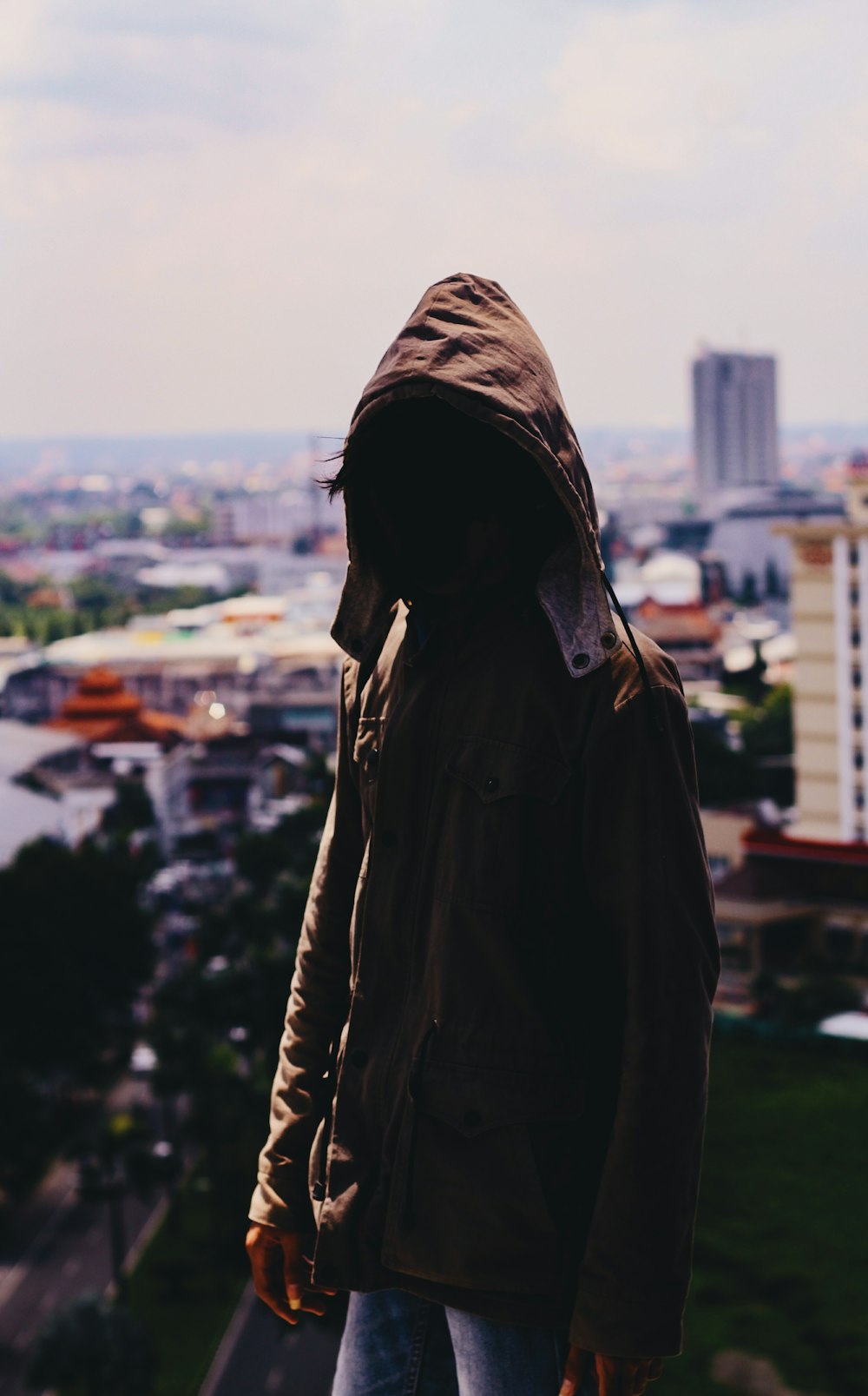 man wearing hooded jacket