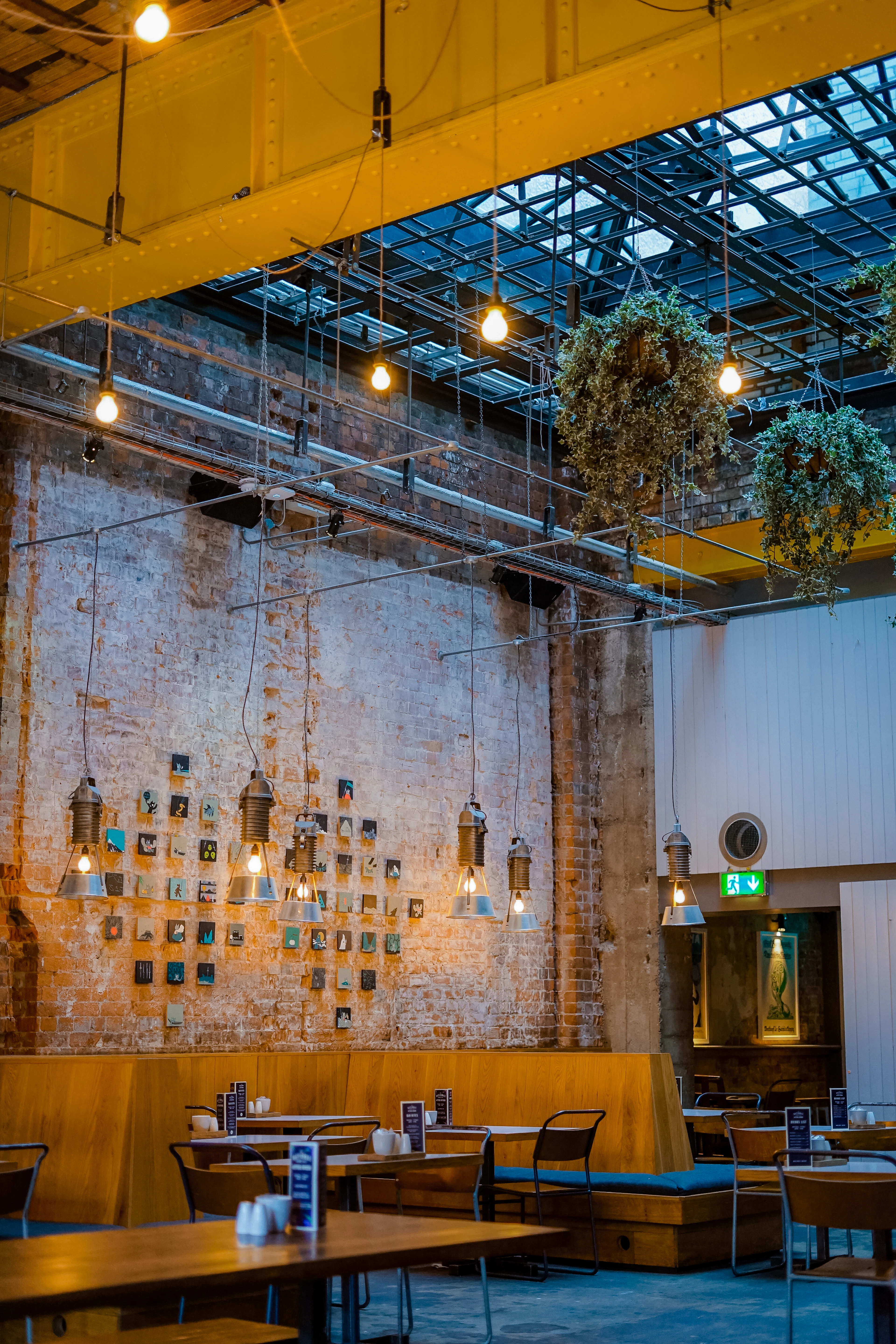 An industrial hall with hanging bulbs