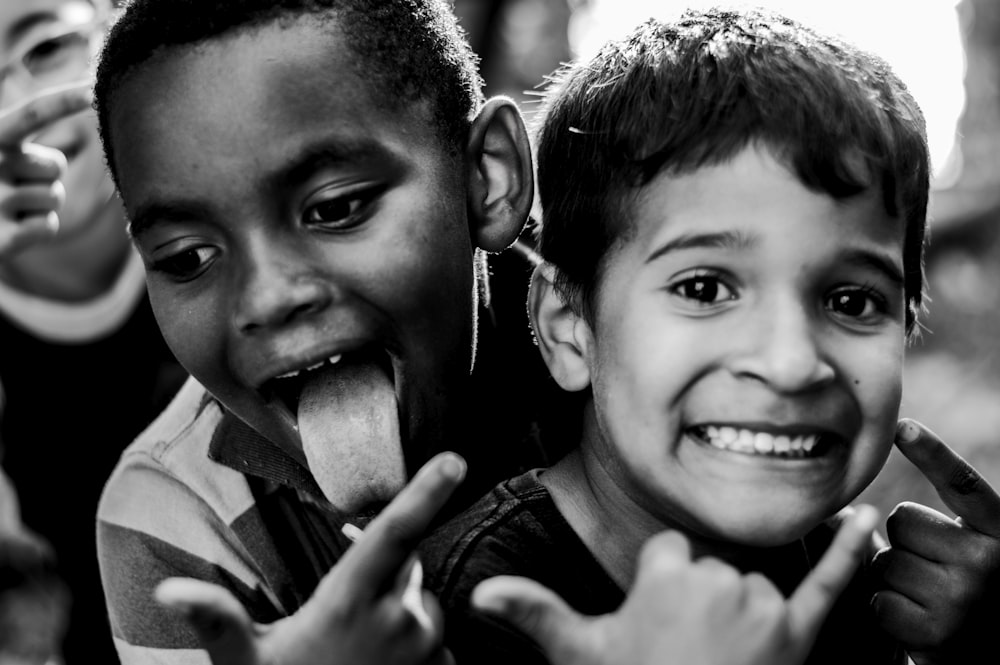 grayscale photo of two boys