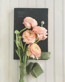 An elegant vintage book cover with romantic floral designs.