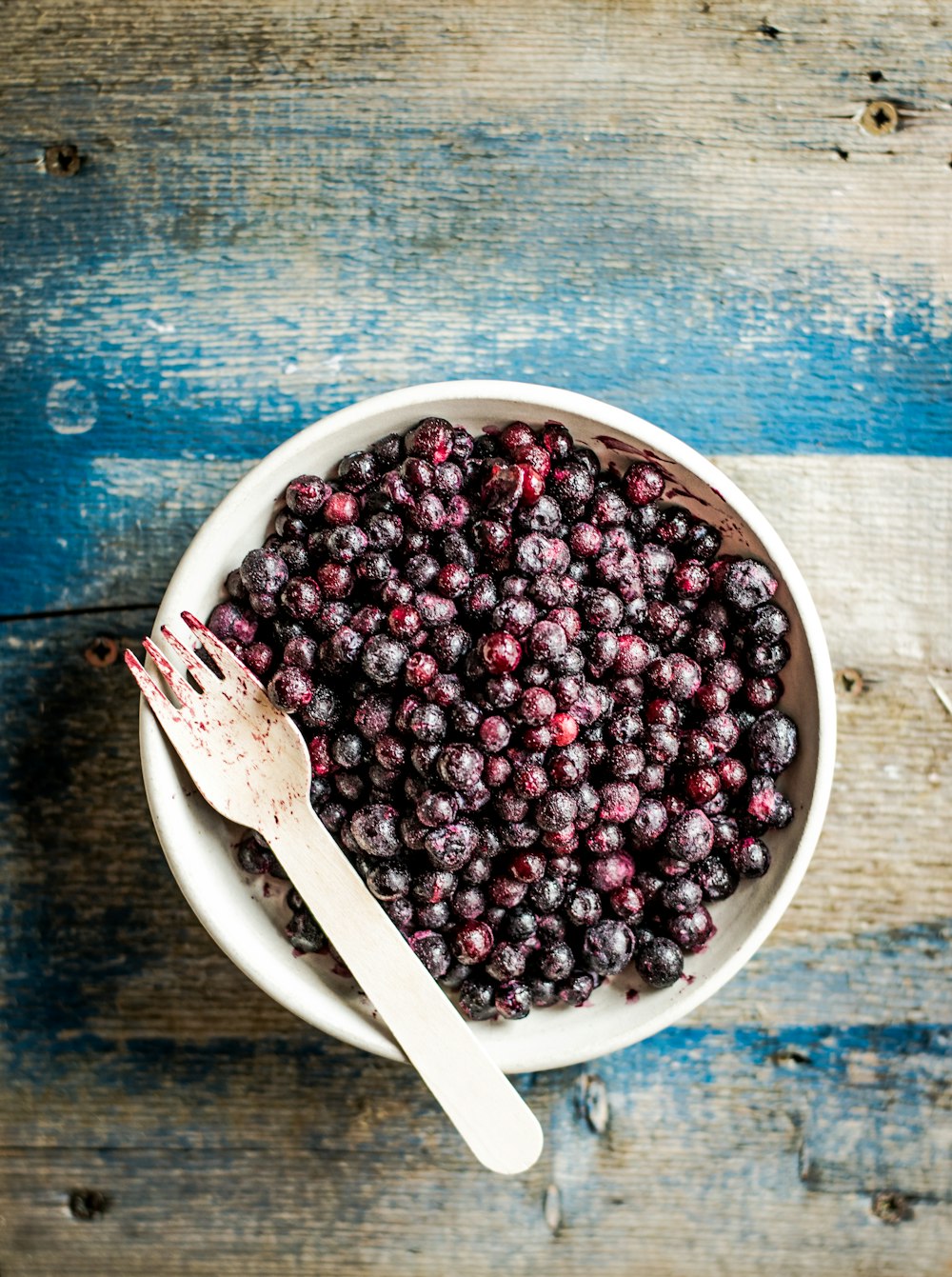 java plum on white ceramic bowl