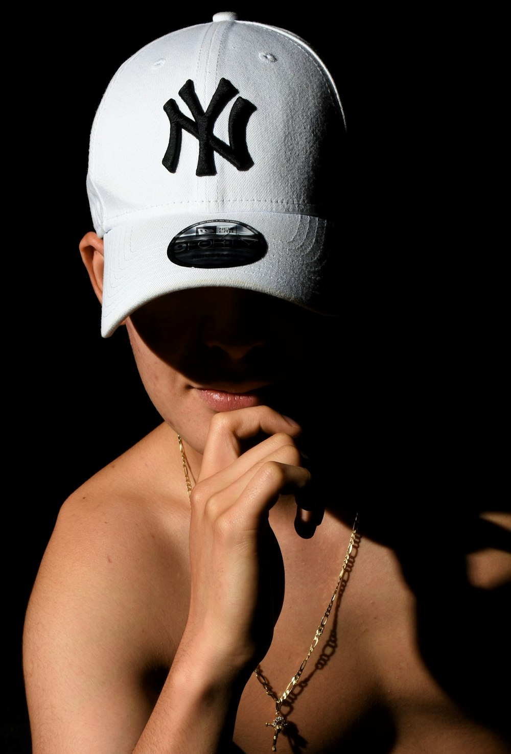 man wearing New York Yankees cap