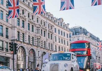 photo of car and bus near castle