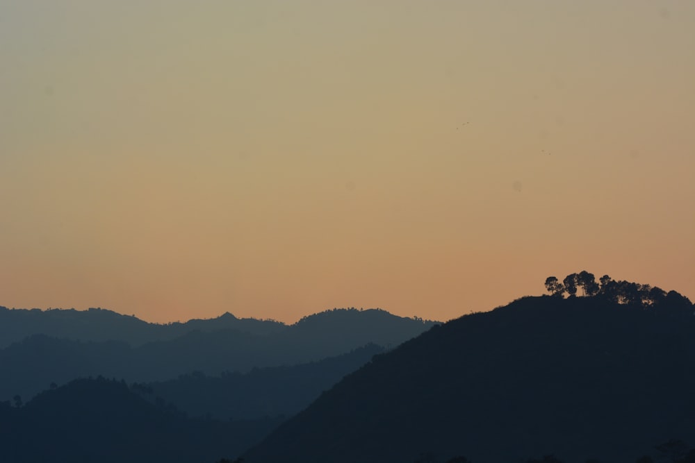 silhouette of mountain at sunrise