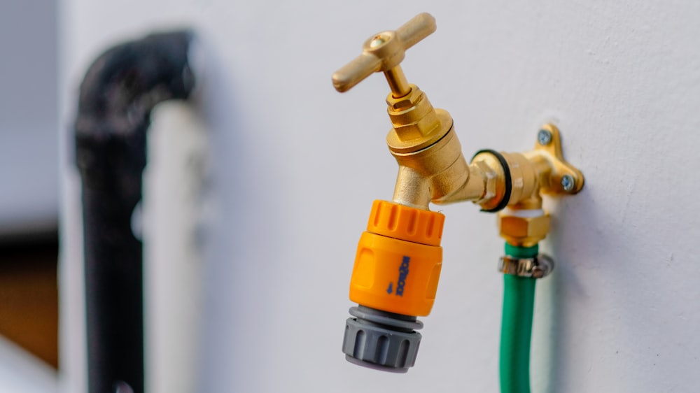 brass-colored faucet